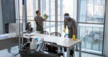 full-shot-men-cleaning-office_23-2149345516